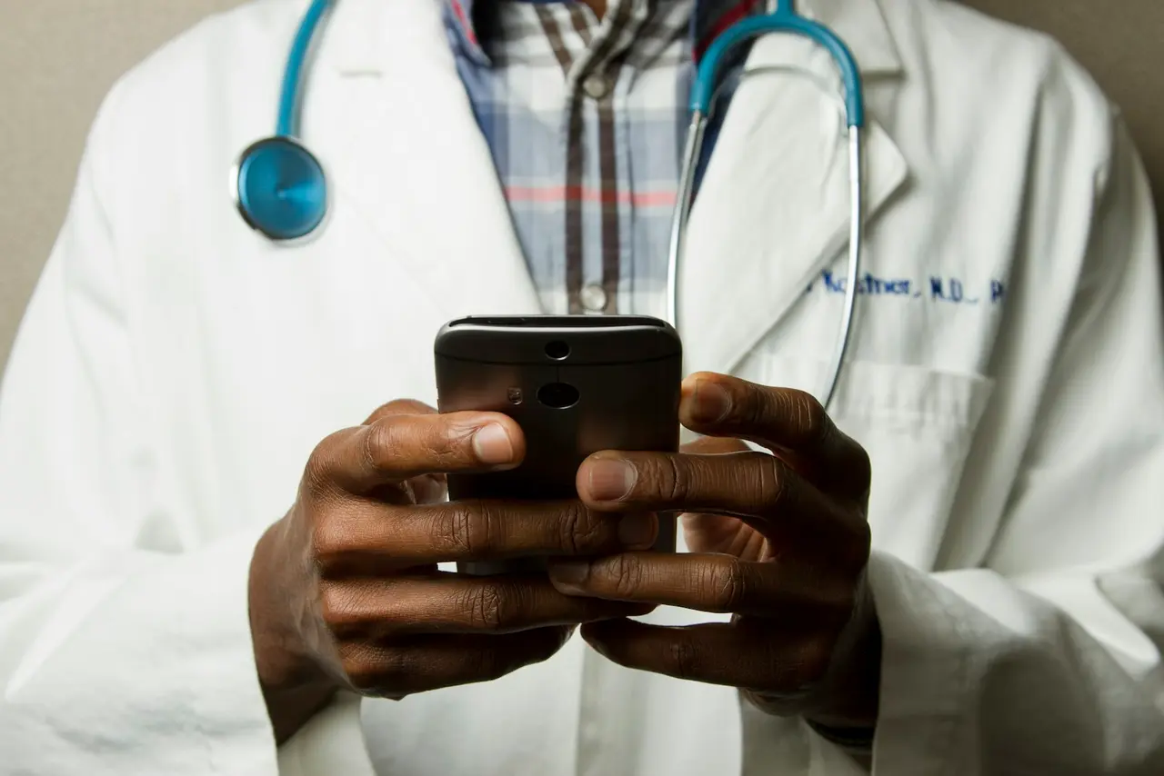 Healthcare professional supporting a patient with care